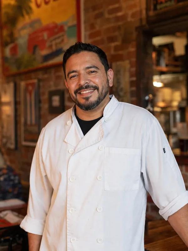 Carlos Vega, owner of La Cocina de Carlos in Miami, in his restaurant dining room